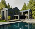 A geothermal pool is bordered with outdoor furnishings from Design Within Reach. The attractive and welcoming landscape architecture surrounding the home was provided by Scot Eckley Inc.