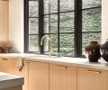 The rift oak cabinetry in “Partola Blonde” is from Northwest Custom Cabinets.