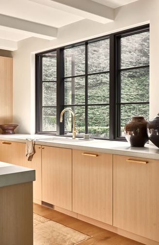 The rift oak cabinetry in “Partola Blonde” is from Northwest Custom Cabinets.