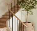 European white oak plank treads from Montello Design with custom handrails and balusters are jaunty. The tile by Tabarka Studio via Ann Sacks on the staircase bring a soft sophistication to each step.