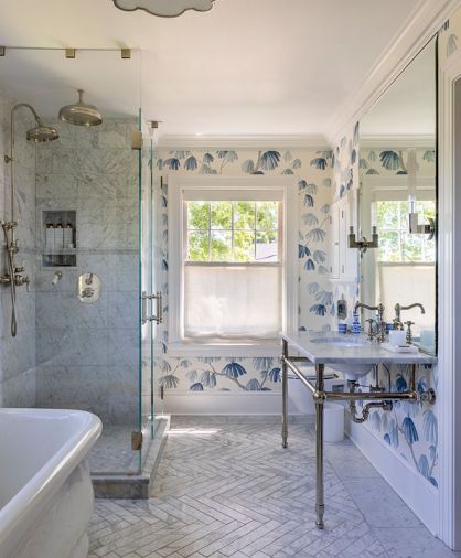 Leonard added “Weeping Pine” wallcovering in “Slate” from Schumacher to sync with the existing tile in the primary bathroom.