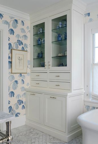 To increase the storage capacity in the bathroom, the cabinetry was custom-designed by Nifelle Design, and fabricated and installed by Northwest Heritage Renovations.