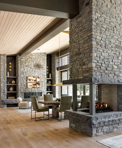 Custom white oak flooring from Montello Design (formerly operated as Eurocraft Hardware Floors) and elegant details, such as this three-sided gas fireplace.