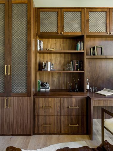 The office has custom walnut cabinetry with a clear finish from Northwest Custom Interiors. Gold Dillon hardware is from RH.
