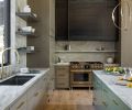 The island is painted in “Jade Romanesque” by Benjamin Moore, and adorned with handles from New York Hardware. The hood vent is oiled metal adding a rustic industrial touch.