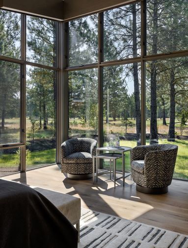 The corner windows are designed for unobstructed views in the primary bedroom, giving the sense that there are no other homes nearby.