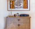 Nifelle Design framed a Hermes silk scarf and placed it with an American white oak credenza.