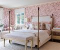 In the daughter’s room, there’s a Cole & Sons “Magnolia in Pink” wall covering from Kravet, ceramic Lotus Lamps from Currey & Company, and an upholstered chair from Hickory Chair Furniture Co.