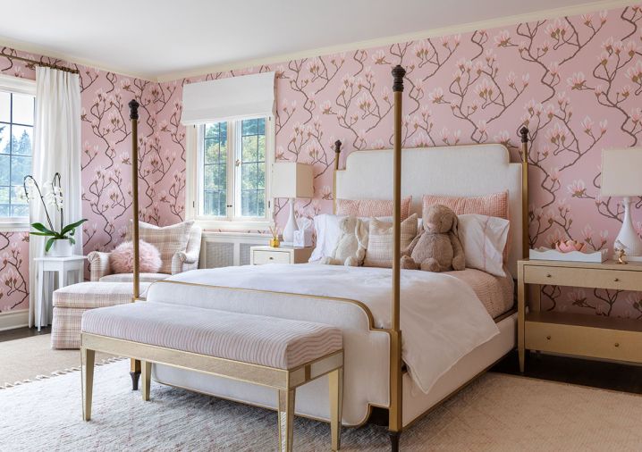 In the daughter’s room, there’s a Cole & Sons “Magnolia in Pink” wall covering from Kravet, ceramic Lotus Lamps from Currey & Company, and an upholstered chair from Hickory Chair Furniture Co.