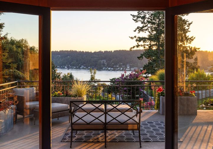 The homeowners love decorating their multiple decks with Restoration Hardware planter boxes bursting with year-round perennials like Japanese Sedge and Coral Bells from Holsapple, drip tubes included. Custom iron railings allow an unobstructed view.