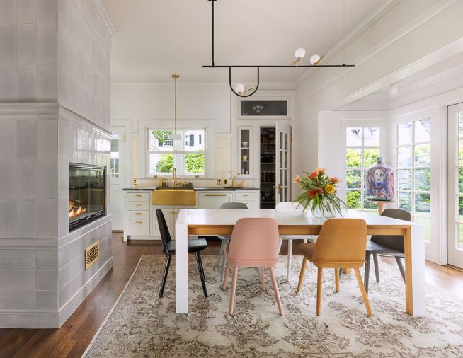 The breakfast room’s brass accents team with appliances from Eastbank Contractor Appliances. The stunning central chimney was completely rebuilt by Portland Fireplace and Chimney.