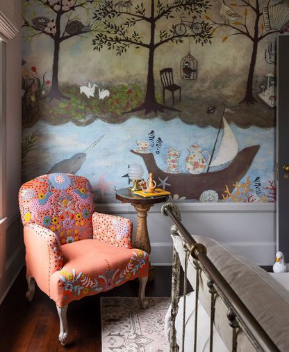 Pam uses provocative wallpaper and artful furnishings to enliven the home’s bedrooms, including this embroidered Unicorn chair and Rebecca Rebouche “Enchanted Forest” wallpaper from Anthropologie.