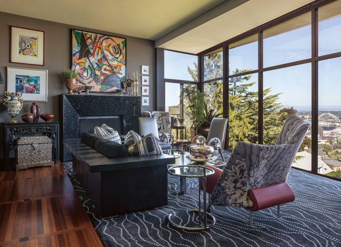 The sofa with faux alligator surround is warmed before a fireplace from Lisac&rsquo;s Fireplaces and Stoves with an Arctic Blue and Absolute Black granite surround. A Kane Allure carpet from Odino Showroom softens underfoot.