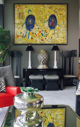 Javier Fernandez&rsquo;s painting Fraternal Strife is grounded with Mackintosh Argyle chairs.