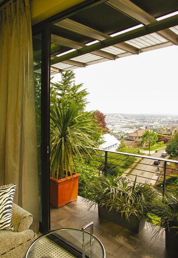 Off the bedroom, the intimate patio offers stellar views to the East, with a handsome black powder-coated steel railing for safety. The easy-to-maintain porcelain slate deck is enjoyed year-round.