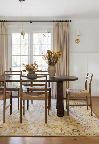 In the dining room, linen window coverings from The Shade Store add a romantic touch.