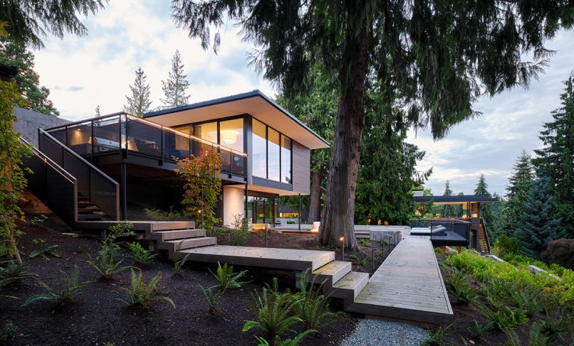 The architecture and construction team saved a plethora of mature trees in the remodel of this Medina residence. It has Loewen windows throughout, sourced from Windows, Doors & More.