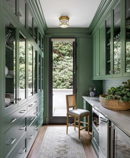 The butler&rsquo;s pantry features the same paint, counters, and tile as the kitchen, with a runner to soften underfoot.