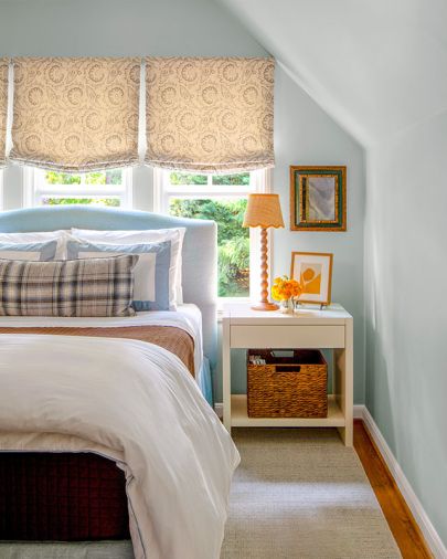 The restive guest suite has custom Roman shades in Claremont fabric by Cindy&rsquo;s Window Fashions.