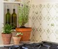 The Delft-style kitchen tile includes custom decorative centers, and was handmade in Portland.