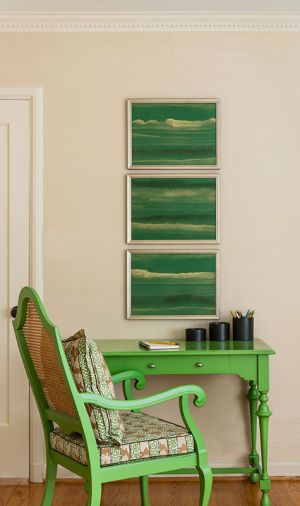 The vintage desk and chair in Shevde&rsquo;s son&rsquo;s room is painted in &ldquo;Parisian Green&rdquo; by Sherwin Williams, and topped with framed sections of hand-painted Fromental silk wallpaper.