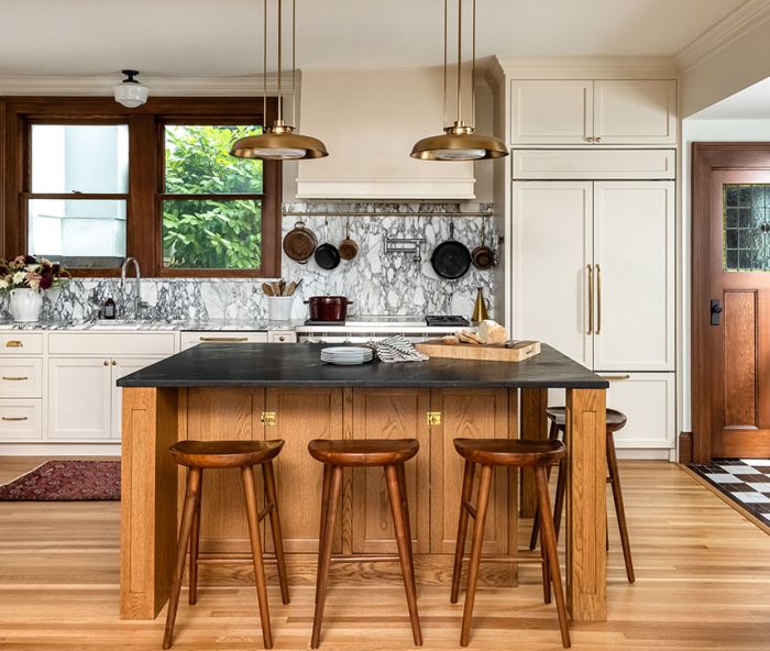 The beauty of an old house often lies in its inherent hominess. Here, walnut, white oak, and fir pair with Calacatta marble counters and custom cabinetry from Bevel.