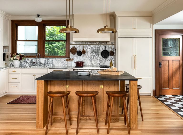 The beauty of an old house often lies in its inherent hominess. Here, walnut, white oak, and fir pair with Calacatta marble counters and custom cabinetry from Bevel.