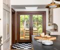 Most of the kitchen&rsquo;s hard-working appliances are hidden by paneling to reduce the cold feel of steel in the renovated kitchen, bringing a clean look and seamless style.
