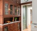 The refinished hutch fits-in perfectly with the pantry cabinetry and beverage center, adding character and everyday ease.