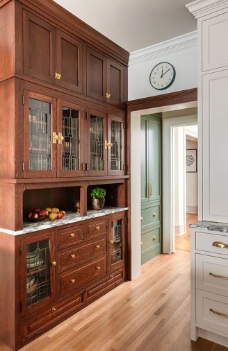 The refinished hutch fits-in perfectly with the pantry cabinetry and beverage center, adding character and everyday ease.