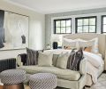 The owners are wrapped in a warm embrace from black radiator to new windows to the &ldquo;Untitled #15  Soicher-Marin artwork and Fabricut fabric upholstered ottomans. The Leslie fixture by Visual Comfort crowns the primary bedroom.