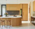 Striking MakuMade Malaga tile from Tempest Tileroom pops against Cement Elegance concrete counters and warm custom rift-sawn white oak cabinetry by Big Branch Woodworking. Eastbank Contractor Appliances supplied Wolf, Miele, Sub-Zero and Cove appliances.