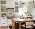 By relocating the island, it is now positioned away from the stove, this shift improved flow allowing for more counter space and ample seating.