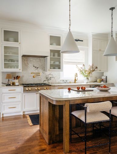 By relocating the island, it is now positioned away from the stove, this shift improved flow allowing for more counter space and ample seating.