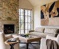In the living room, an Arden Home sofa and a vintage rug from Driscoll Robbins Fine Carpets grounds the space, while roller shades from Hartmann & Forbes hang discreetly at the windows.