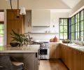 The engineered oak flooring throughout the home is from Montello Design (formally known as Eurocraft Hardwood Floors, LLC). In the kitchen, the floors sync with the rift cut white oak cabinetry.