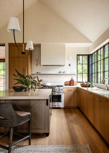 The engineered oak flooring throughout the home is from Montello Design (formally known as Eurocraft Hardwood Floors, LLC). In the kitchen, the floors sync with the rift cut white oak cabinetry.