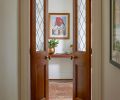 Bright Designlab designed the custom doors to the primary suite. The doors are made of custom oak and leaded-style glass, fabricated by Master Furniture Makers.