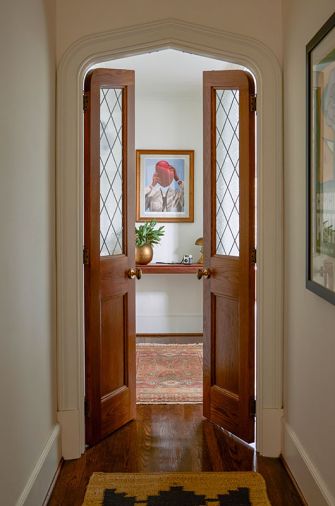 Bright Designlab designed the custom doors to the primary suite. The doors are made of custom oak and leaded-style glass, fabricated by Master Furniture Makers.