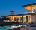 The design embraces abundant natural light as well as view of the 36  pool from the guest bedroom, kitchen, dining and living room. Outdoor amenities include deck seating, a pool shower, and nearby fire pits with heated seats.
