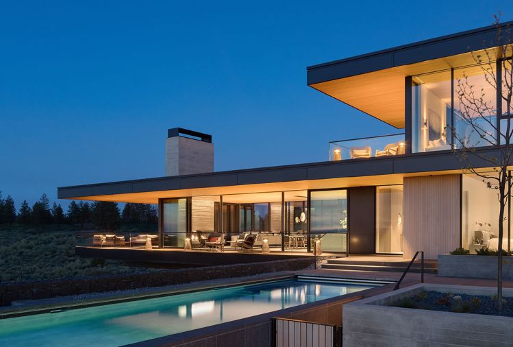 The design embraces abundant natural light as well as view of the 36' pool from the guest bedroom, kitchen, dining and living room. Outdoor amenities include deck seating, a pool shower, and nearby fire pits with heated seats.