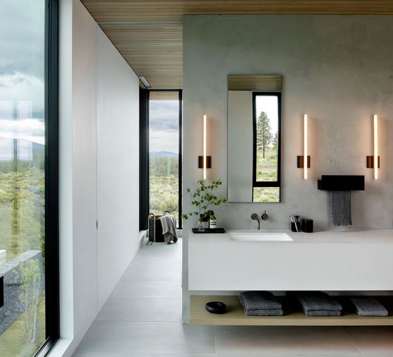 The FQ Designs custom medicine cabinet built by Anderson Clark Interiors crowns a quartz countertop in &ldquo;Fresh Concrete&rdquo; color. A rift-sawn white oak floating shelf and Sonneman Stiletto lights round out the space.