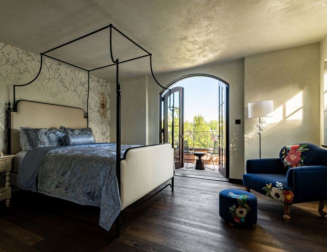 The primary bedroom has access to the backyard via doors to the terrace.