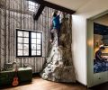 The children have a custom climbing &ldquo;rock&rdquo; wall fabricated by Turnstone Construction. The wallpaper is the &ldquo;Woods & Stars&rdquo; pattern from Cole & Son, while in the bunk room, there&rsquo;s Blue Planetarium wallcovering from Superfresco.