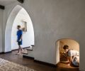 Downstairs, a secret passageway is accessed by an arched alcove at the floor.