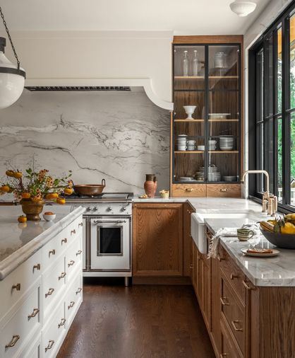 The counters and backsplash are Swan Quartzite from Architectural Surfaces. At the wash station, there&rsquo;s a Whitehaven farmhouse sink and Brizo Artesso faucet, both from Ferguson Home.