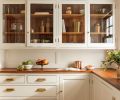 While much of the butler&rsquo;s pantry remained intact, a replacement glass shade for an existing fixture was sourced through Portland&rsquo;s beloved Hippo Hardware. Existing Douglas fir counters were refinished by Conners Cabinetry and Woodworks LLC. and stained with a custom color.