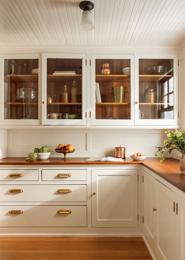 While much of the butler&rsquo;s pantry remained intact, a replacement glass shade for an existing fixture was sourced through Portland&rsquo;s beloved Hippo Hardware. Existing Douglas fir counters were refinished by Conners Cabinetry and Woodworks LLC. and stained with a custom color.