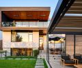 The outdoor rooms, including a kitchen, dining area, and lounge, were master planned with Steven Yavanian. The dining area has a table and chairs from Summer House. The house&rsquo;s flat roof is from Stoneway Roofing, joined with Ceraclad Panasonic siding.