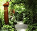 The three and a half foot wide walkway is made of concrete that’s combed while wet to give it an unusual texture, and then acid-stained for color and extra dimension. At the end of the walkway, two cast bronze Thai temple lions greet visitors.